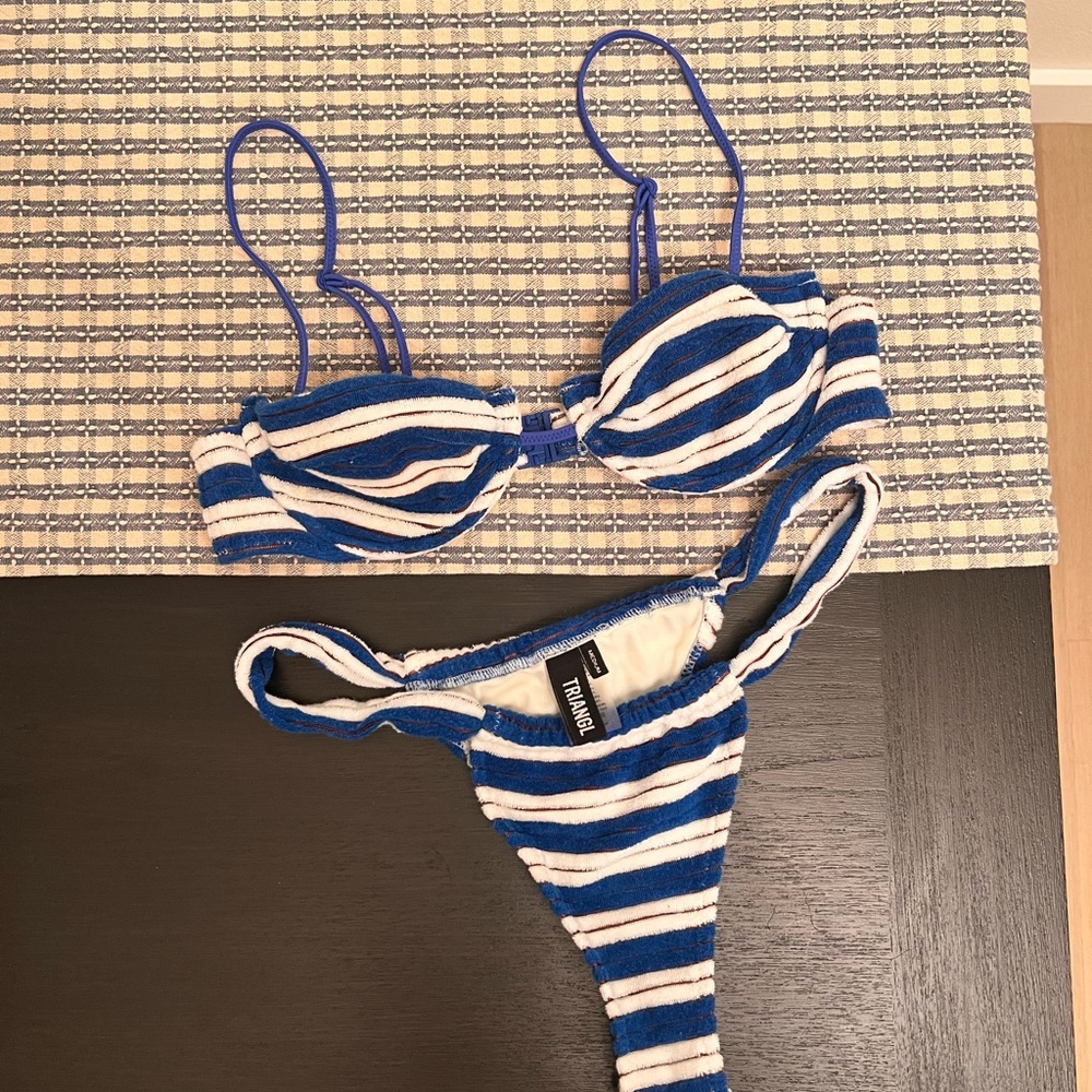 Triangl Bikini top is size small bottoms are size medium. Only worn once.